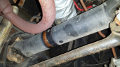 Axle rubbing on heater hose